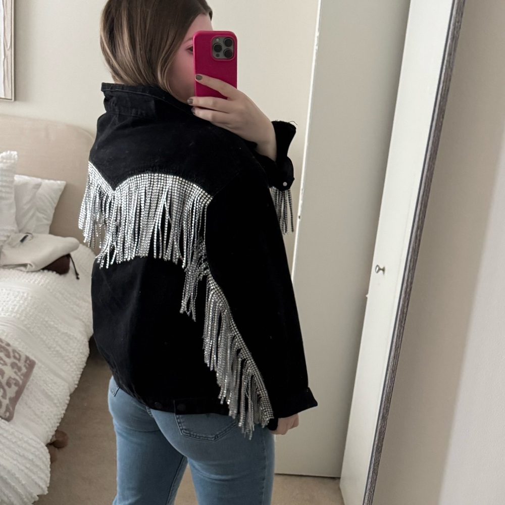 Black denim jacket with fringe
